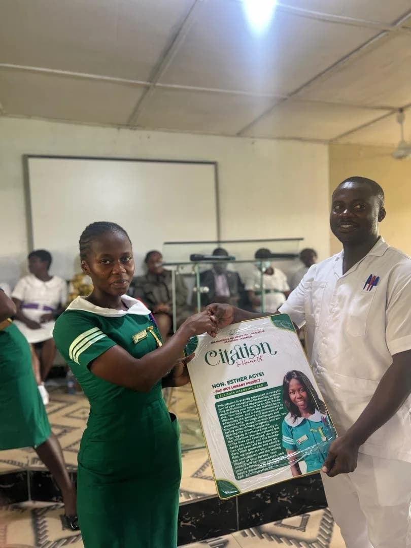 Citation award presentation with Michelle Serwaa Anyimadu as SRC President 2025/2026 with woman in striped dress