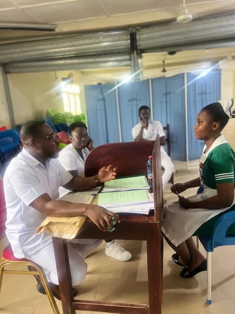 A student nurse responding to examiners questions during an oral clinical assessment