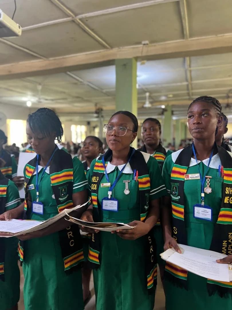 Multiple female students in green nursing uniforms seated in auditorium during SRC handover ceremony